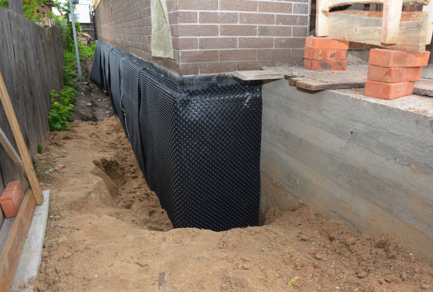SJ Waterproofing Pros technician performing targeted Wet Basement Repair assessment in Lookout Mountain, GA